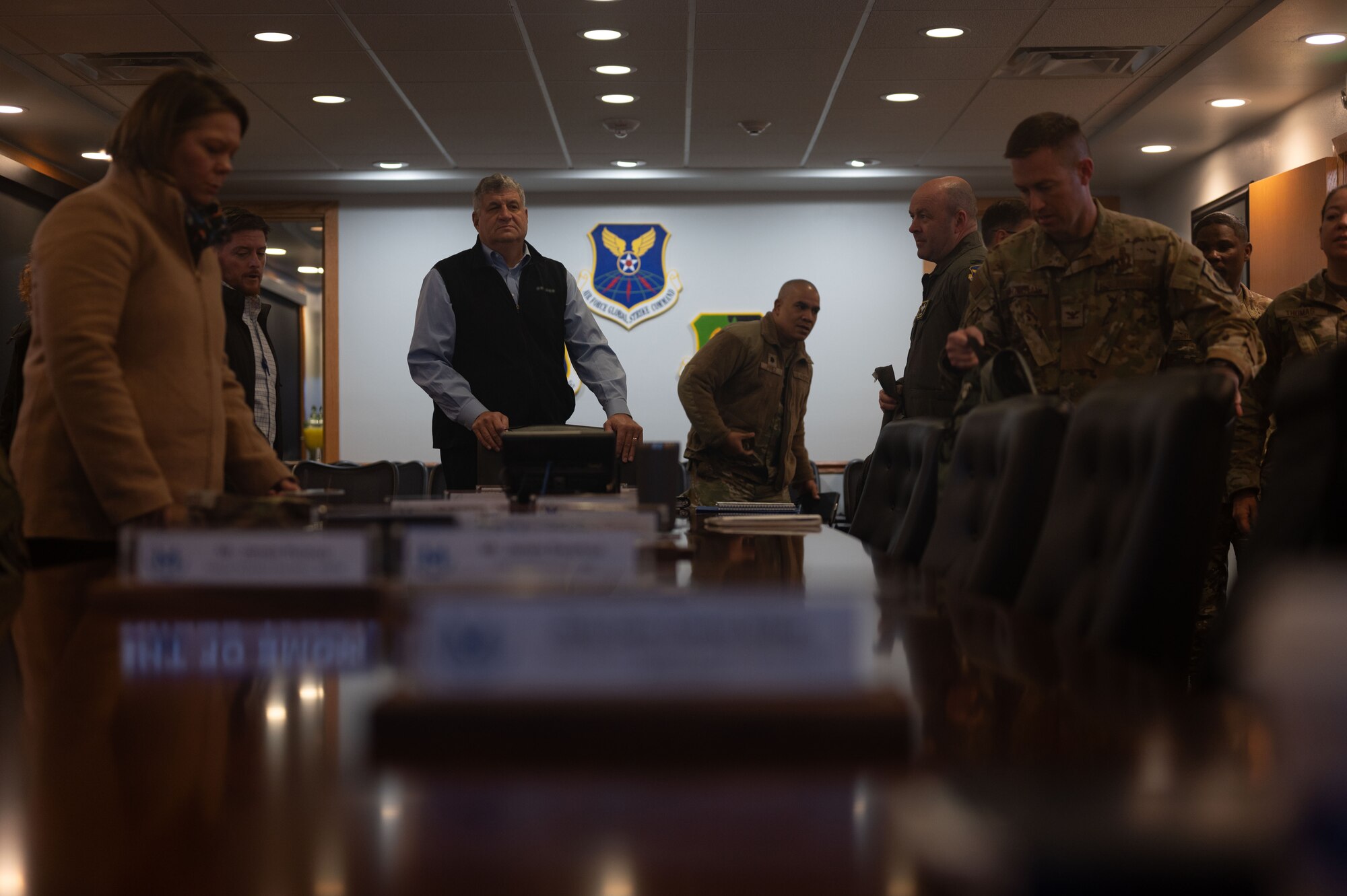 Dr. William LaPlante, Under Secretary of Defense for Acquisition and Sustainment, tour the 5th Bomb Wing headquarters and attends a combined mission brief at Minot Air Force Base, North Dakota, Oct. 30, 2024. LaPlante's role encompasses oversight of acquisition policies, defense logistics and the readiness of installations to support mission success. (U.S. Air Force photo by Airman 1st Class Luis Gomez)