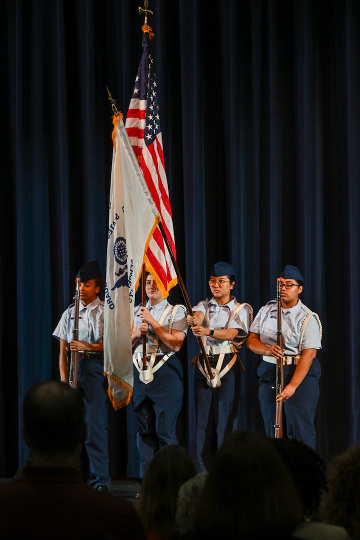 Innovation High School JROTC color guard presents the colors during the Coast Guard Junior Reserve Officers' Training Corps (JROTC) unit establishment ceremony at Innovation High School Orlando, Florida, Nov. 8, 2024. Innovation High School’s Coast Guard JROTC unit is the 12th in the nation and is the largest to-date, with over 190 cadets enrolled in the inaugural semester.    (U.S. Coast Guard photo by Petty Officer 1st Class Riley Perkofski)