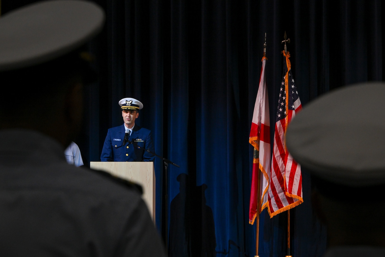 Coast Guard Cmdr. Clay Cromer, Coast Guard JROTC program manager, addresses guests during the Coast Guard Junior Reserve Officers' Training Corps (JROTC) unit establishment ceremony at Innovation High School Orlando, Florida, Nov. 8, 2024. Innovation High School’s Coast Guard JROTC unit is the 12th in the nation and is the largest to-date, with over 190 cadets enrolled in the inaugural semester.    (U.S. Coast Guard photo by Petty Officer 1st Class Riley Perkofski)