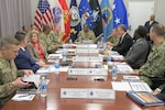Defense Logistics Agency Director Army Lt. Gen. Mark Simerly, center left, addresses U.S. Transportation Command Commander Air Force Gen. Randall Reed