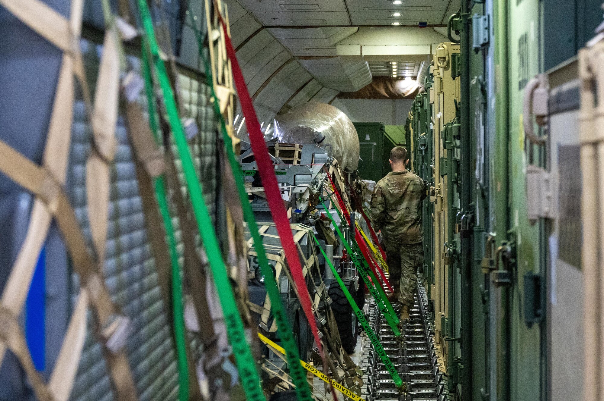 A Pathfinder walks among cargo aboard a Kalitta Air Boeing 747