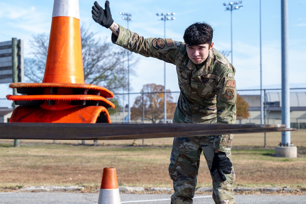 U.S. Airman 1st Class Jose Alonso, 436th Logistics Readiness Squadron logistic plans apprentice, directs a forklift during the LRS Mission Ready Airman Rodeo at Dover Air Force Base, Delaware, Nov. 7, 2024. The Rodeo consisted of three events intended to prepare Airmen for the future fight and meet MRA qualifications in a competitive, engaging and safe competition. (U.S. Air Force photo by Senior Airman Amanda Jett)