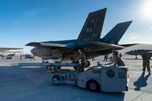 Airmen load a munition on an F-35A Lightning II.