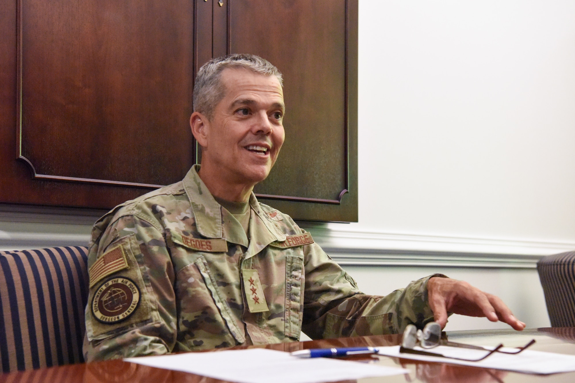 Image of an Airman sitting at a table.