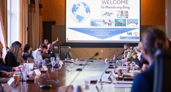 NPS researcher and Climate Security Network cofounder Kristen Fletcher welcomes government officials and military officers from NATO member and partner countries to NPS.