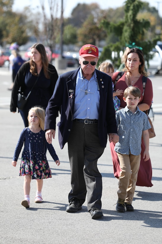 A Marine Veteran and his family arrive at Churchill Downs for the Survivors' Day at the Races in Louisville, Kentucky, Nov. 3, 2024. The United States Army Survivor Outreach Services team partners with Churchill Downs each year for this event.