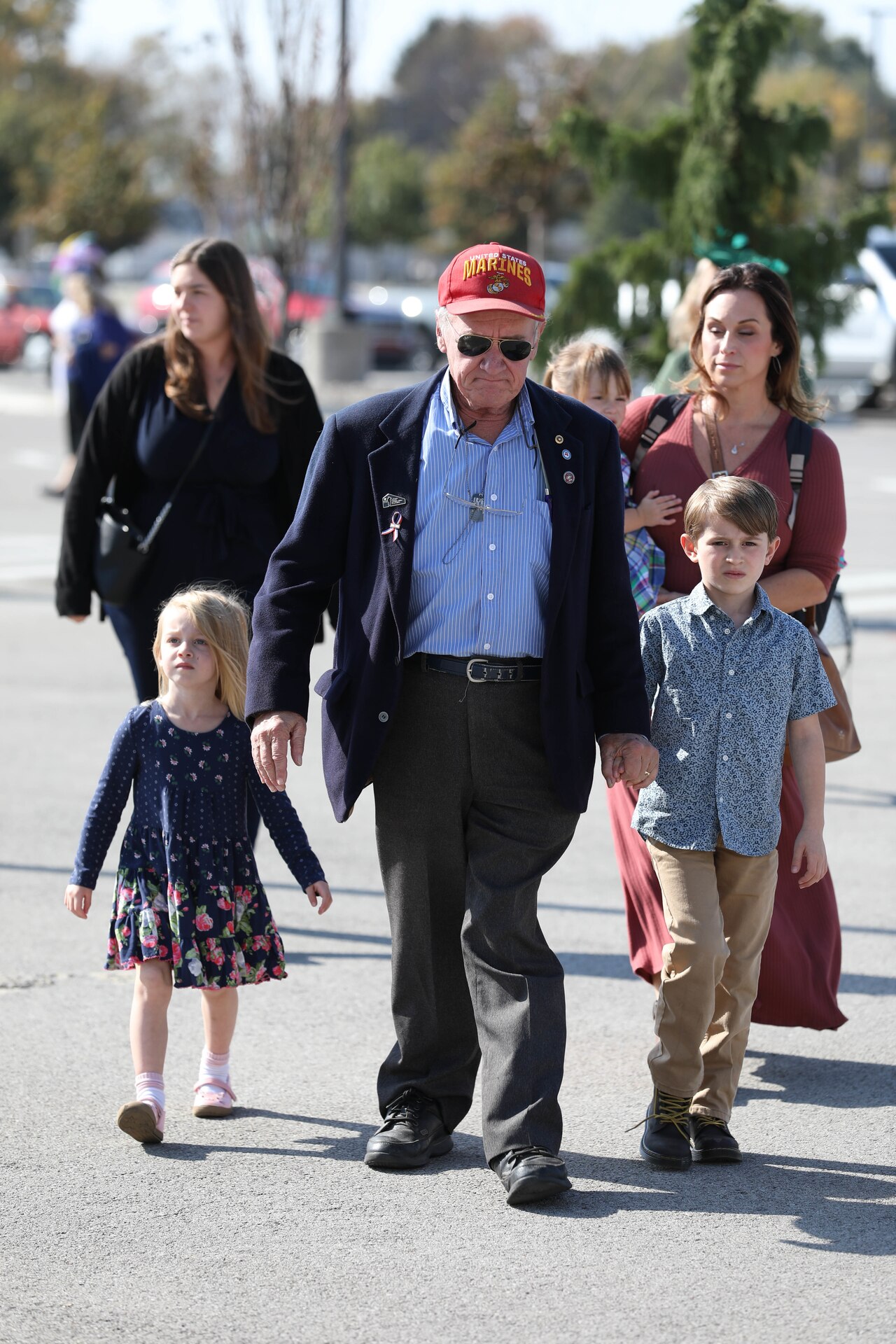 A Marine Veteran and his family arrive at Churchill Downs for the Survivors' Day at the Races in Louisville, Kentucky, Nov. 3, 2024. The United States Army Survivor Outreach Services team partners with Churchill Downs each year for this event.