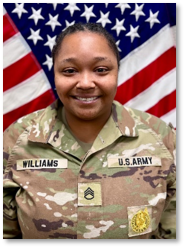 Female Soldier posed in front of U.S. flag