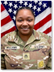 Female Soldier posed in front of U.S. flag