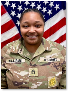 Female Soldier posed in front of U.S. flag