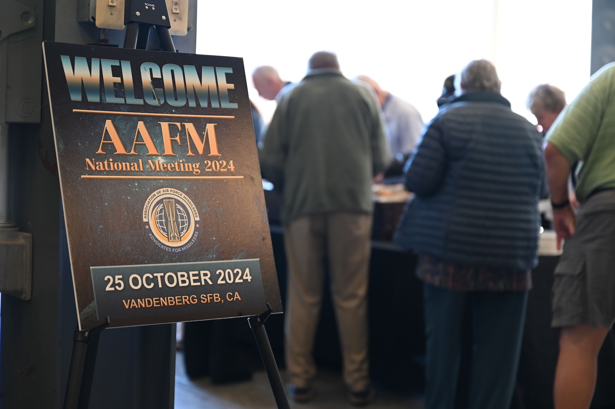 A sign says "welcome, AAFM national meeting 2024."