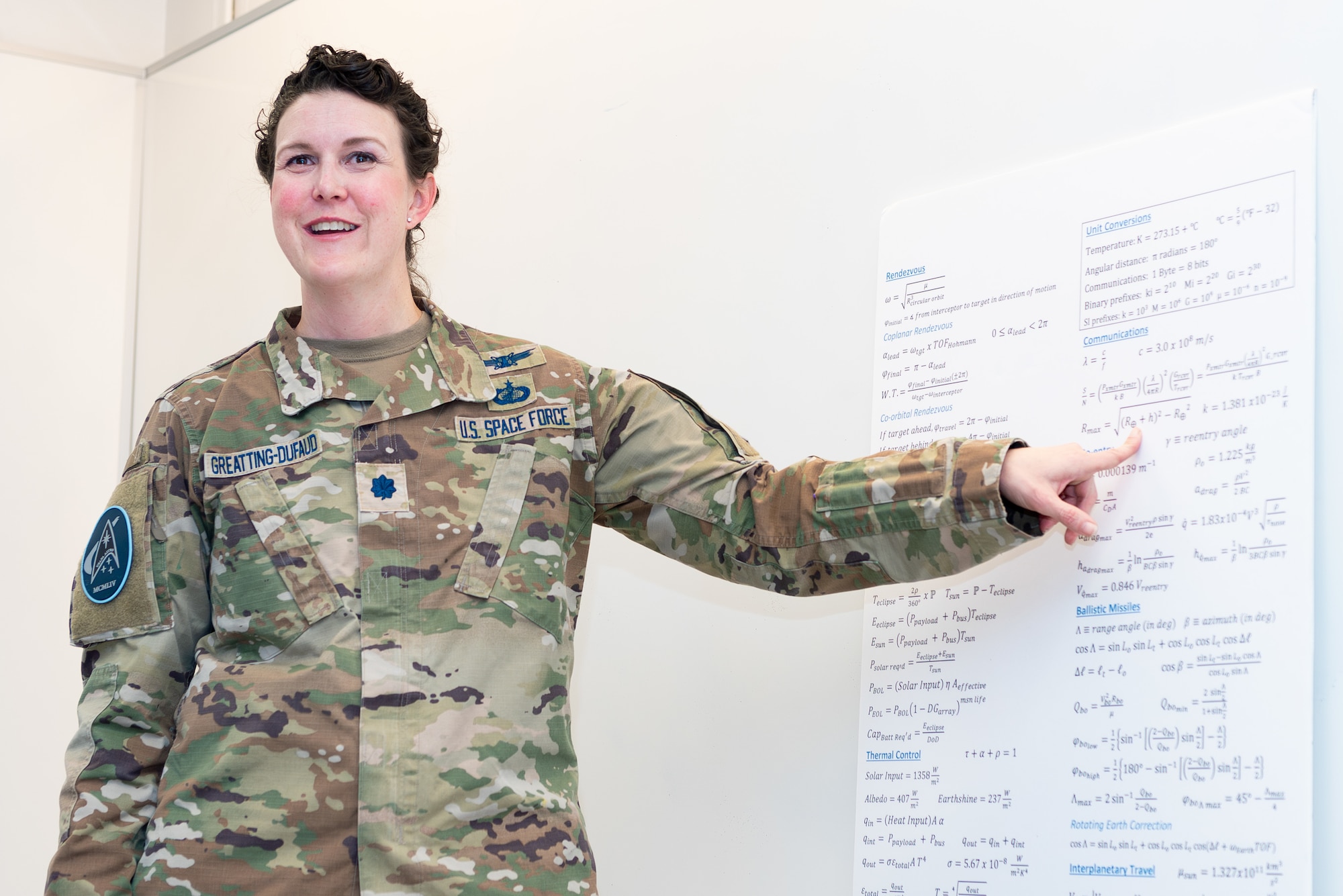 Lt. Col. Heather Greatting-Dufaud, U.S. Air Force Academy Astronautical Engineering instructor, teaches cadets during her Introduction to Astronautical Engineering course at the Academy, Colo., Oct. 31, 2024. She graduated from the Academy in 2005 and channels her experience as a student into her teaching, hoping to instill the same passion for astronautical engineering in her cadets. (U.S. Air Force photo by Ray Bahner)