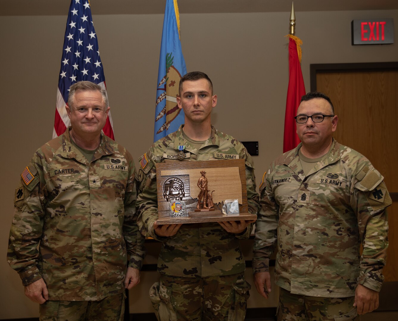 Sgt. James Bording, a resident of Claremore, Oklahoma serving as an infantryman in the 1st Battalion, 279th Infantry Regiment, 45th Infantry Brigade Combat Team, poses with Command Sgt. Maj. John Hernandez, the state command sergeant major for Oklahoma and Brig. Gen. Brad Carter, assistant adjutant general - Army for Oklahoma, after Bording was announced as the 2025 Oklahoma Army National Guard Noncommissioned Officer of the Year, at Camp Gruber Training Center, Oklahoma, Nov. 8, 2024. (Oklahoma National Guard photo by Spc. Cambrie Cannon)