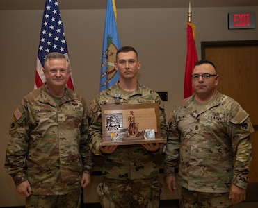 Sgt. James Bording, a resident of Claremore, Oklahoma serving as an infantryman in the 1st Battalion, 279th Infantry Regiment, 45th Infantry Brigade Combat Team, poses with Command Sgt. Maj. John Hernandez, the state command sergeant major for Oklahoma and Brig. Gen. Brad Carter, assistant adjutant general - Army for Oklahoma, after Bording was announced as the 2025 Oklahoma Army National Guard Noncommissioned Officer of the Year, at Camp Gruber Training Center, Oklahoma, Nov. 8, 2024. (Oklahoma National Guard photo by Spc. Cambrie Cannon)