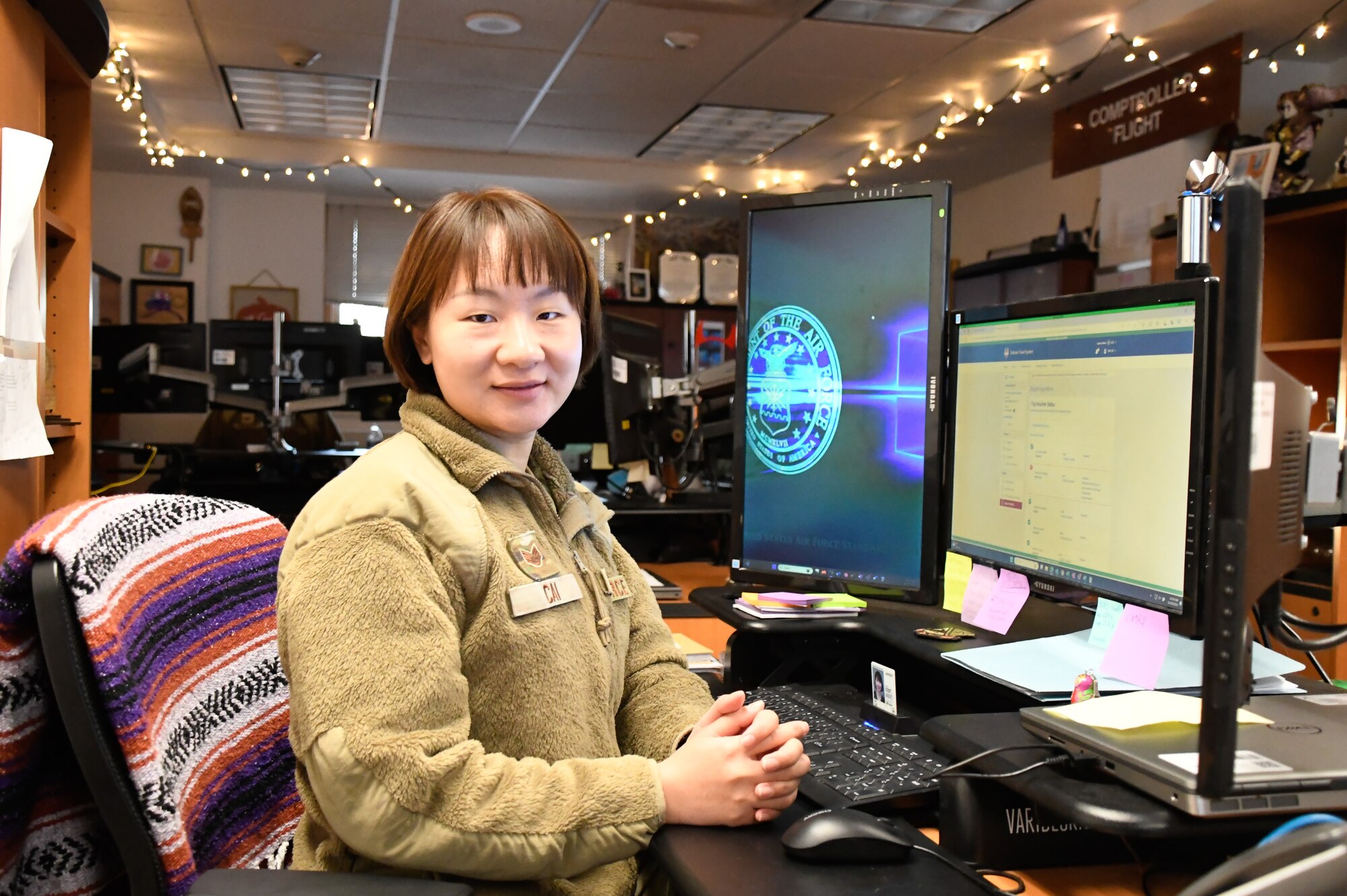 Senior Airman Yao Cai, 168th Wing financial operations technician, processes defense travel system authorizations and vouchers to ensure Airmen are reimbursed for mission travel requirements.