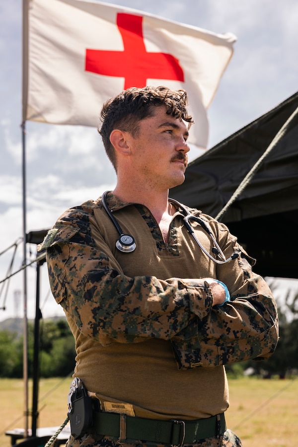 U.S. Navy Hospital Corpsman 2nd Class David Doyle, a preventative medical technician with Marine Rotational Force-Southeast Asia, poses for a photo during KAMANDAG 8 at Camp Cape Bojeador, Burgos, Philippines, Oct. 20, 2024. KAMANDAG is an annual Philippine and U.S. Marine Corps-led exercise aimed at enhancing the Armed Forces of the Philippines’ defense and humanitarian capabilities by providing valuable training in combined operations with foreign militaries in the advancement of a Free and Open Indo-Pacific. This year marks the eighth iteration of this exercise and includes participants from the French Armed Forces, Royal Thai Marine Corps, and Indonesian Marine Corps; including continued participation from the Australian Defense Force, British Armed Forces, Japan Ground Self-Defense Force, and Republic of Korea Marine Corps. MRF-SEA is a rotational unit derived from elements of I Marine Expeditionary Force executing a U.S. Marine Corps Forces Pacific operational model that involves training events and exchanges with partner military subject matter experts, promotes security goals with Allied and partner nations, and ensures a persistent I MEF presence west of the International Date Line. (U.S. Marine Corps photo by Sgt. Shaina Jupiter)