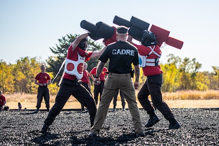 Thunderbird Challenge Program cadets take part in a pugil stick bout during TCP’s field day at Camp Gruber Training Center, Oklahoma, Oct. 25, 2024. The Thunderbird Challenge Program is a 22-week tuition-free program operated by the Oklahoma Military Department and Oklahoma National Guard that provides Oklahoma students in need of school credit recovery with military-based structure, high school or GED classes, college courses, job training and essential life skills. (Oklahoma National Guard photo by Anthony Jones)