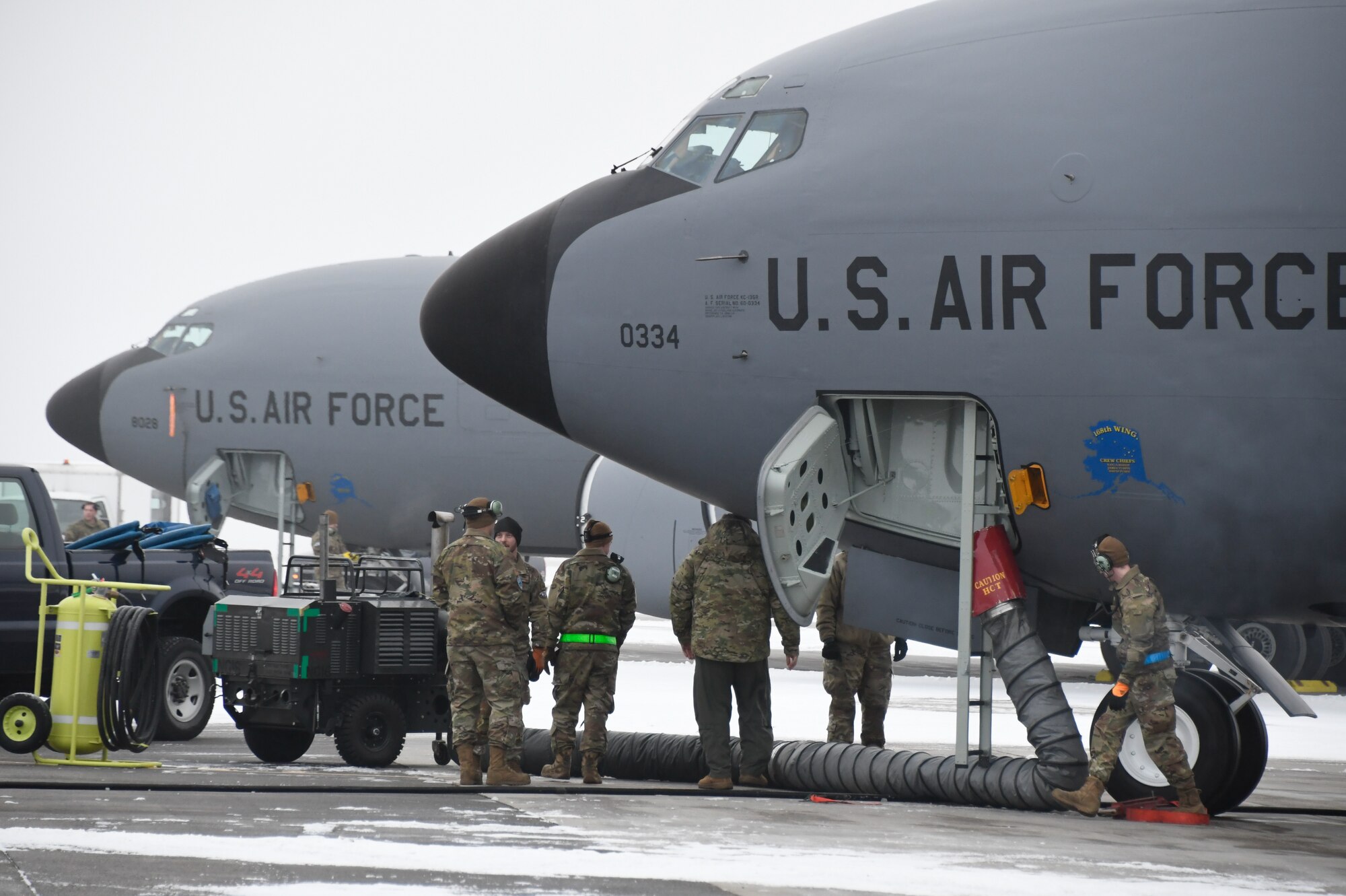 The 168th Wing Aircraft Maintenance Airmen prepare an Alaska Air National Guard KC-135 Stratotanker for an aerial refueling flight during a “communications out” exercise at Eielson Air Force Base.