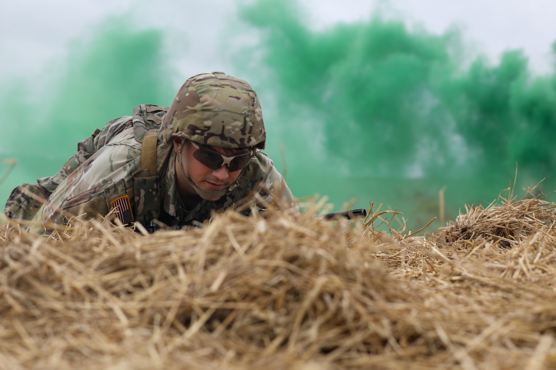 U.S. Army Spc. Matthew Adkins, an information technology specialist with Headquarters and Headquarters Company, 103rd Brigade Support Battalion, high-crawls to his objective during the 2025 Kentucky Best Warrior Competition held at Wendell H. Ford Regional Training Center in Greenville, Kentucky, Nov. 6, 2024. This competition showcases the adaptiveness, resilience, and lethality of our forces, affirming the readiness of National Guard citizen-Soldiers to meet the nation’s challenges.