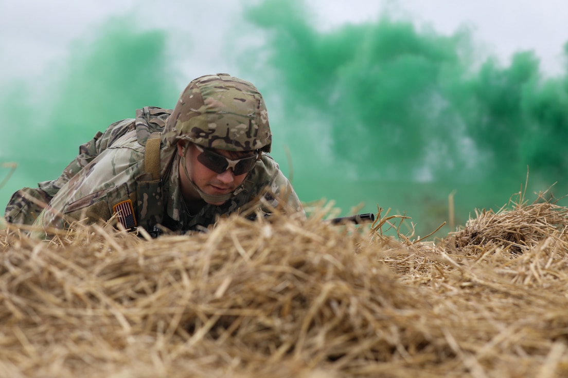 U.S. Army Spc. Matthew Adkins, an information technology specialist with Headquarters and Headquarters Company, 103rd Brigade Support Battalion, high-crawls to his objective during the 2025 Kentucky Best Warrior Competition held at Wendell H. Ford Regional Training Center in Greenville, Kentucky, Nov. 6, 2024. This competition showcases the adaptiveness, resilience, and lethality of our forces, affirming the readiness of National Guard citizen-Soldiers to meet the nation’s challenges.