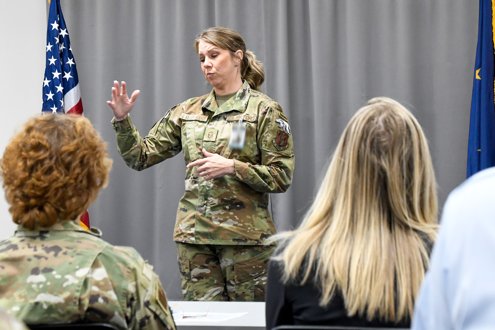Master Sgt. Seana O'Kelley-Hooker, Senior Non-Commissioned Officer in charge of Medical Administration for the 168th Medical Group, shares her experience during the October drill roll call on October 17, 2024, after responding to a rollover accident on the icy highway while on the way to Eielson Air Force Base for work during a snowy morning in Fairbanks, Alaska.