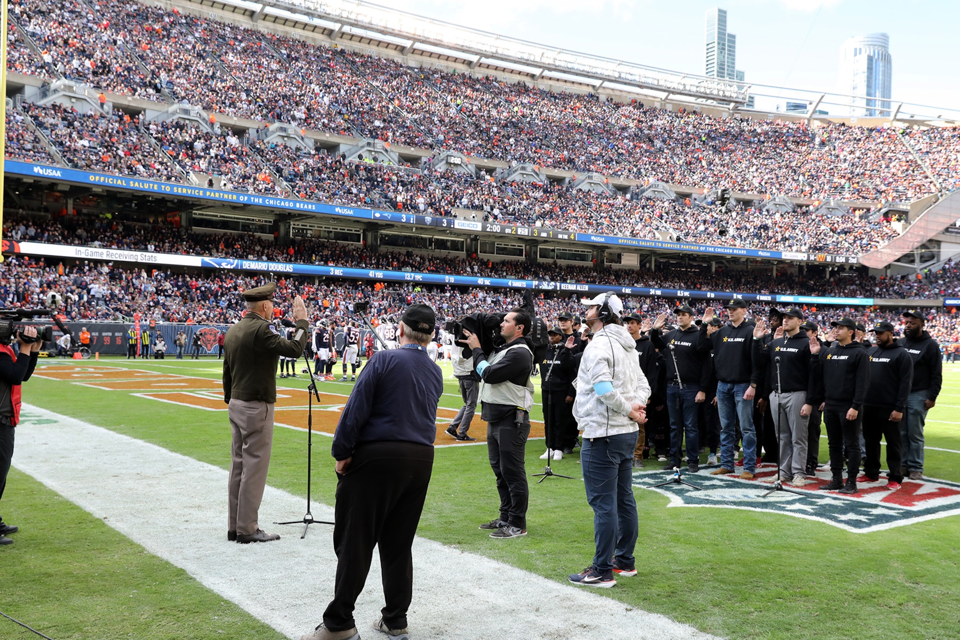 General Randy George, Chief of Staff of the United States Army, delivers the oath of enlistment to nearly two dozen Future Soldiers during the Chicago Bears ‘Salute to Service’ game, November 10, 2024, at Soldier Field in Chicago.