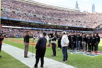 General Randy George, Chief of Staff of the United States Army, delivers the oath of enlistment to nearly two dozen Future Soldiers during the Chicago Bears ‘Salute to Service’ game, November 10, 2024, at Soldier Field in Chicago.