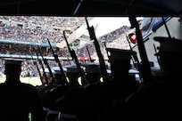 Members of the United States Marine Corps Silent Drill Platoon prepare to step onto Soldier Field for the half time performance of the Chicago Bears versus New England Patriots game on November 10, 2024.