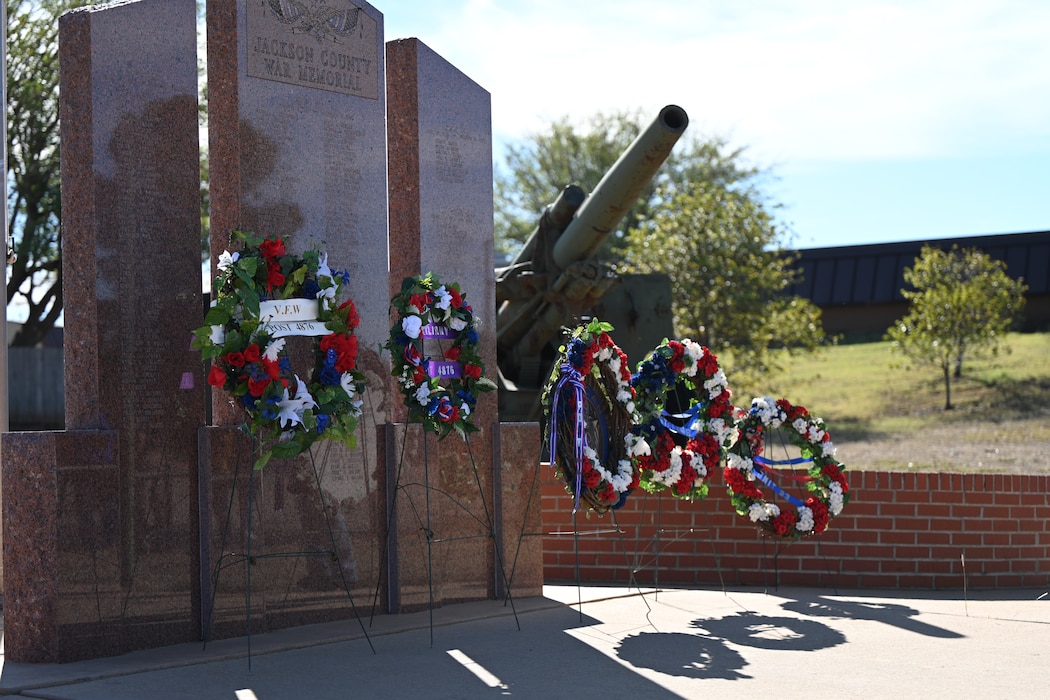 A photo of wreaths presented at the Jackson County War Memorial at Altus, Oklahoma, Nov. 11, 2024. Members of VFW Post 4876 and Col. Amanda Knotts, 97th Mission Support Group commander, presented the wreaths in honor of Veterans Day. (U.S. Air Force photo by Airman 1st Class Lauren Torres)