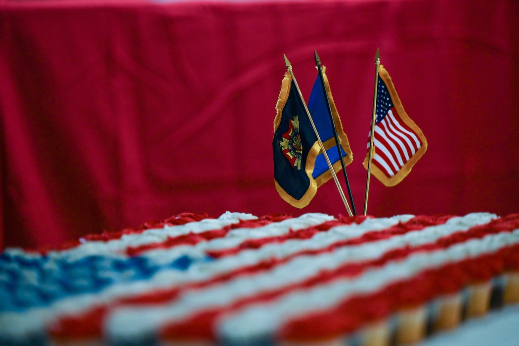 A photo of the veterans of foreign wars flag, the U.S. Air Force flag, and the U.S. flag displayed on cupcakes at the VFW Post 4876 at Altus, Oklahoma, Nov. 11, 2024. The VFW is a nonprofit organization that serves veterans through legislative advocacy, community service programs, and programs for young people and educators. (U.S. Air Force photo by Airman 1st Class Lauren Torres)