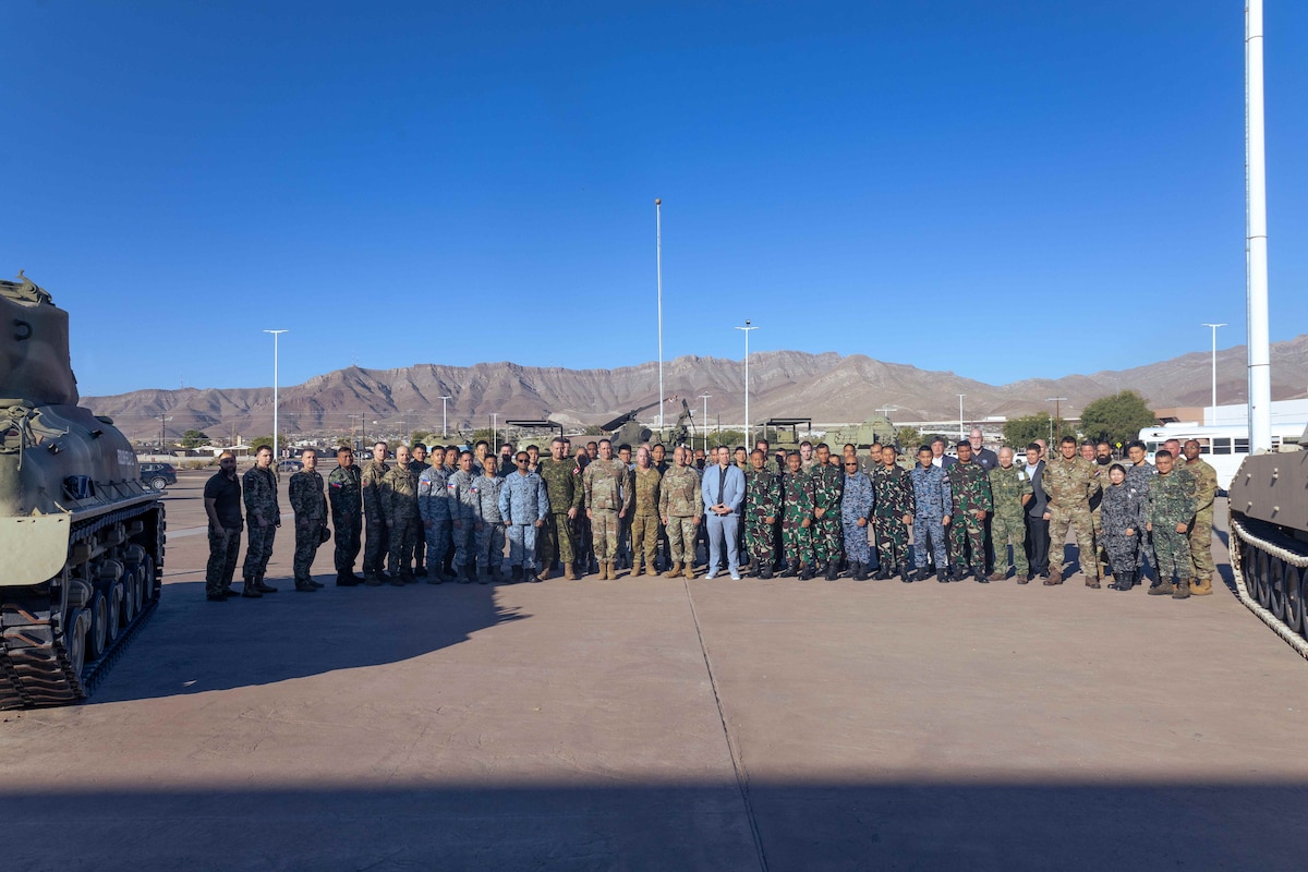 A multilateral and joint delegation of 11 nations and 4 US organizations pose together outside the 1 AD Museum. The Pacific IAMD Center facilitated 11 nations during the 2024 Multilateral Subject Matter Expert Exchange and Defense Design Workshop from 21-26 October on Fort Bliss, Texas.