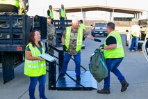 U.S. Air Force personnel load baggage into the back of a stake-bed truck during a “bag drag” on Beale Air Force Base, California, Sept. 25, 2024
