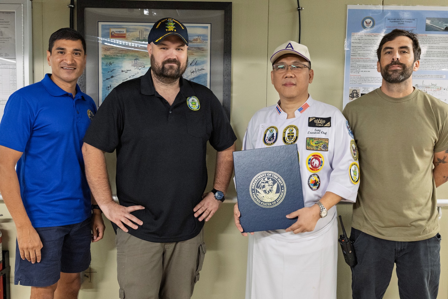 SRIRACH, Thailand— U.S. Navy Lt. Cmdr. Jamil A. Khan, left, chaplain, MSC Far East; civilian mariner Capt. Chris Jackson, ship’s master, expeditionary fast transport ship USNS City of Bismarck (T-EPF 9); Pongpisit Ungsuchaikij, head chef at a popular hotel in Pattaya, Thailand; and civilian mariner Colin B. Smith, chief mate, City of Bismarck; pose for a photograph aboard City of Bismarck in Sriracha, Thailand, Nov. 6, 2024. Ungsuchaikij was presented with a letter of appreciation for his volunteer work with U.S. Navy League Siam Council in Pattaya, Thailand, serving the U.S. Navy. (U.S. Navy photo by Grady T. Fontana)