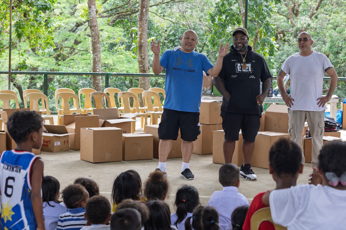 SUBIC BAY, Philippines—left to right, civilian mariners Celerino A. Monton, steward utility; Sean A. Joyner, steward utility; and Gustavo Luna, chief steward; assigned to expeditionary fast transport ship USNS Puerto Rico (T-EPF 11), greet students of the Aningway-Sacatihan Elementary School Annex/ High School, during a community outreach event within the Aeta community, Subic Bay, Philippines, Oct. 29, 2024. The Aeta are indigenous people who live in scattered, isolated mountainous parts of Luzon, Philippines. (U.S. Navy photo by Grady T. Fontana)