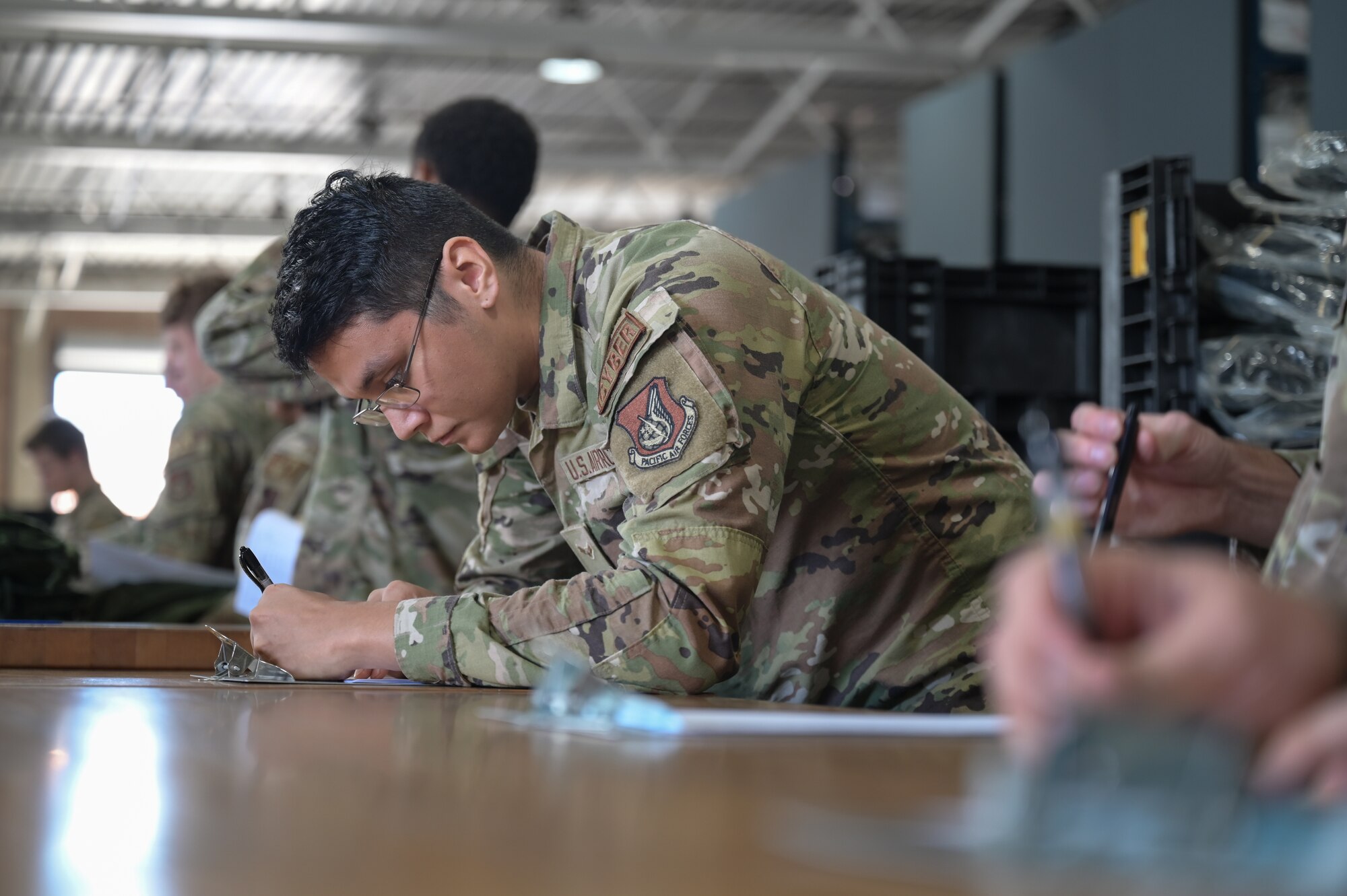 Airmen go through a mobility equipment processing line.