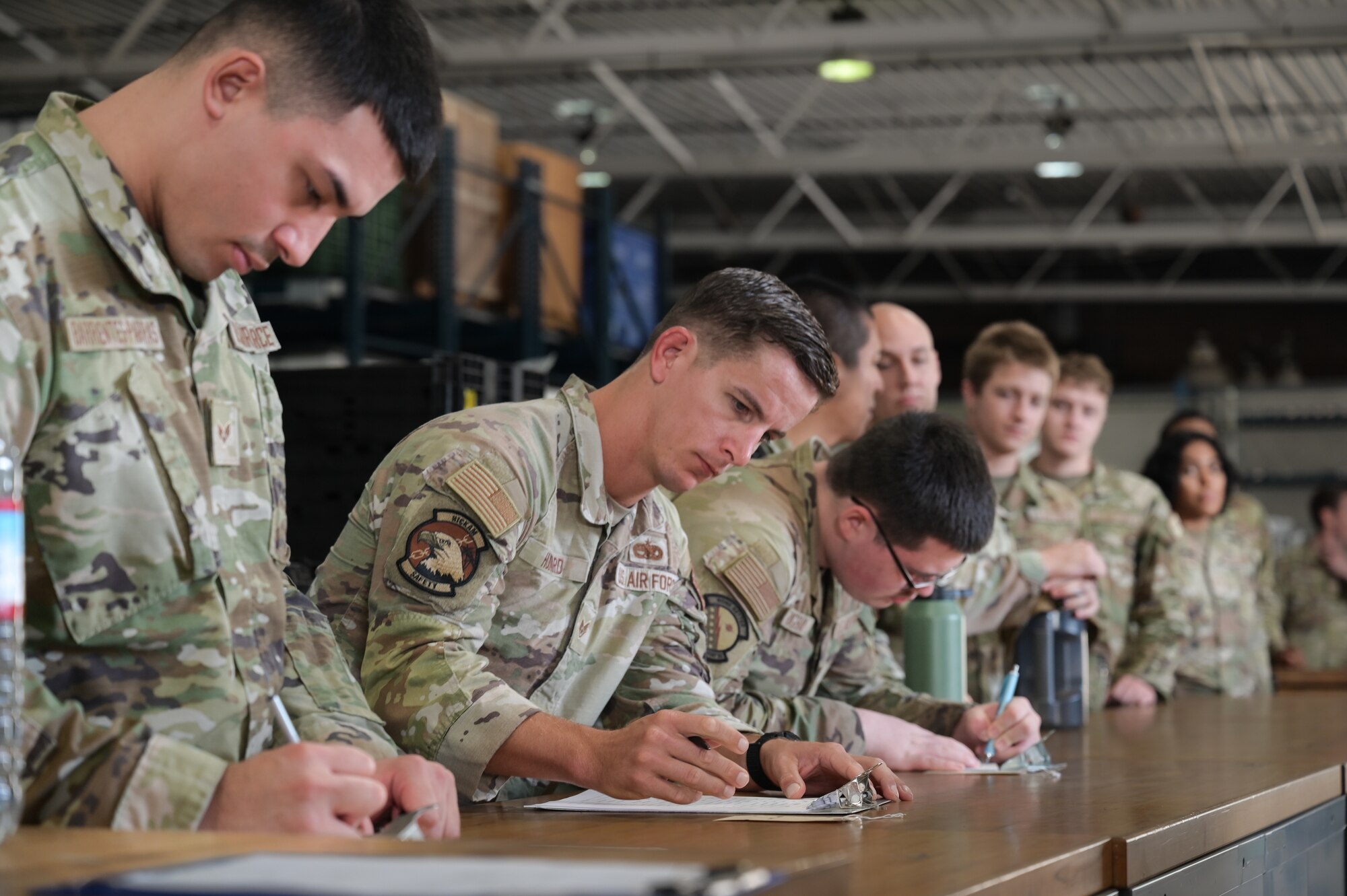 Airmen go through a mobility equipment processing line.