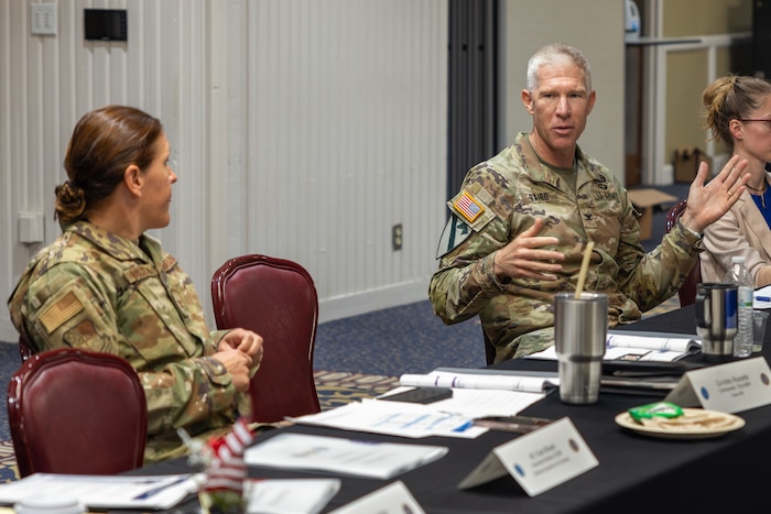 Man and woman talking at table