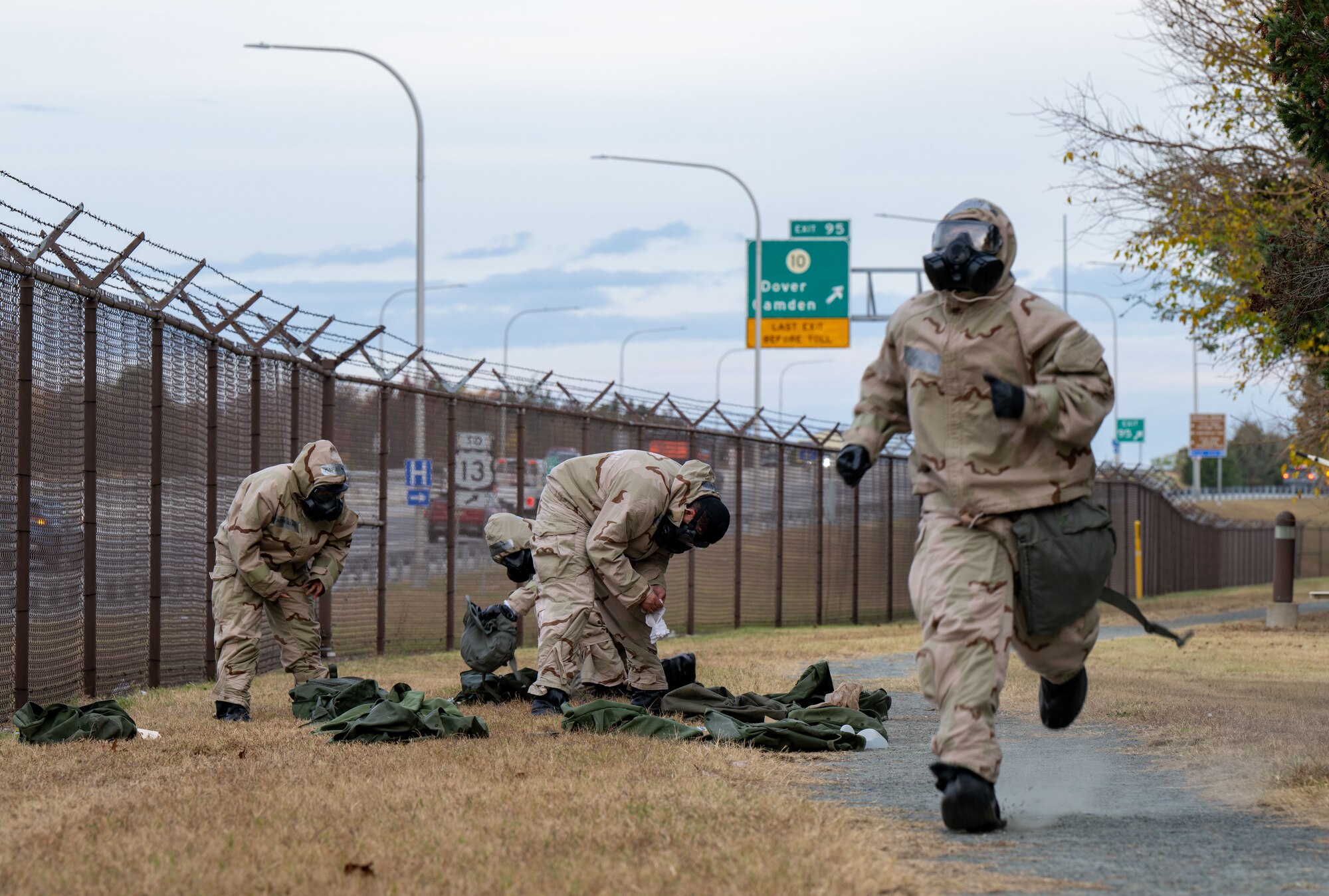 A member from the 436th Logistics Readiness Squadron runs in Mission-Oriented Protective Posture gear during the LRS Mission Ready Airman Rodeo at Dover Air Force Base, Delaware, Nov. 7, 2024. The Rodeo consisted of three events intended to prepare Airmen for the future fight and meet MRA qualifications in a competitive, engaging and safe competition. (U.S. Air Force photo by Senior Airman Amanda Jett)