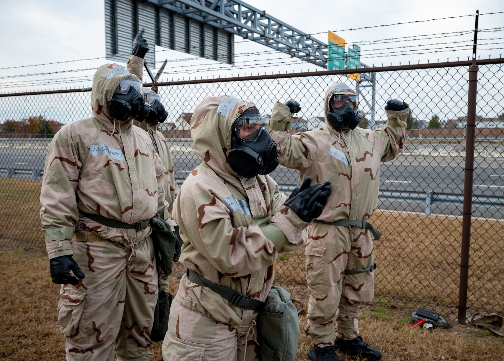Members from the 436th Logistics Readiness Squadron cheer on their team while in Mission-Oriented Protective Posture gear, during the LRS Mission Ready Airman Rodeo at Dover Air Force Base, Delaware, Nov. 7, 2024. The Rodeo consisted of three events intended to prepare Airmen for the future fight and meet MRA qualifications in a competitive, engaging and safe competition. (U.S. Air Force photo by Senior Airman Amanda Jett)