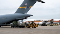 Pathfinders guide a 10K all terrain forklift offloading equipment