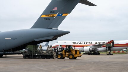 Pathfinders guide a 10K all terrain forklift offloading equipment