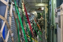 A Pathfinder walks among cargo aboard a Kalitta Air Boeing 747