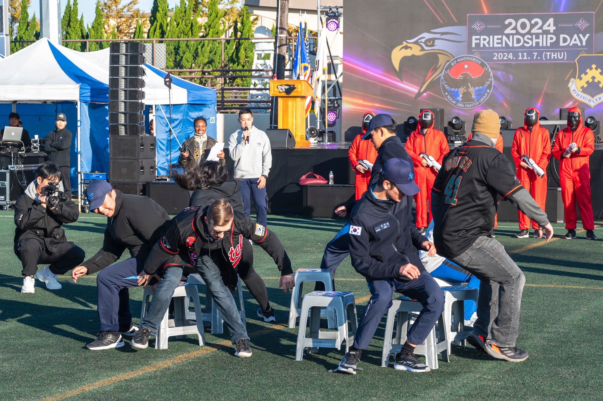 Members from the U.S. Air Force 8th Fighter Wing and the Republic of Korea Air Force 38th Fighter Group, participate in a game of musical chairs during Friendship Day at Kunsan Air Base, Republic of Korea.