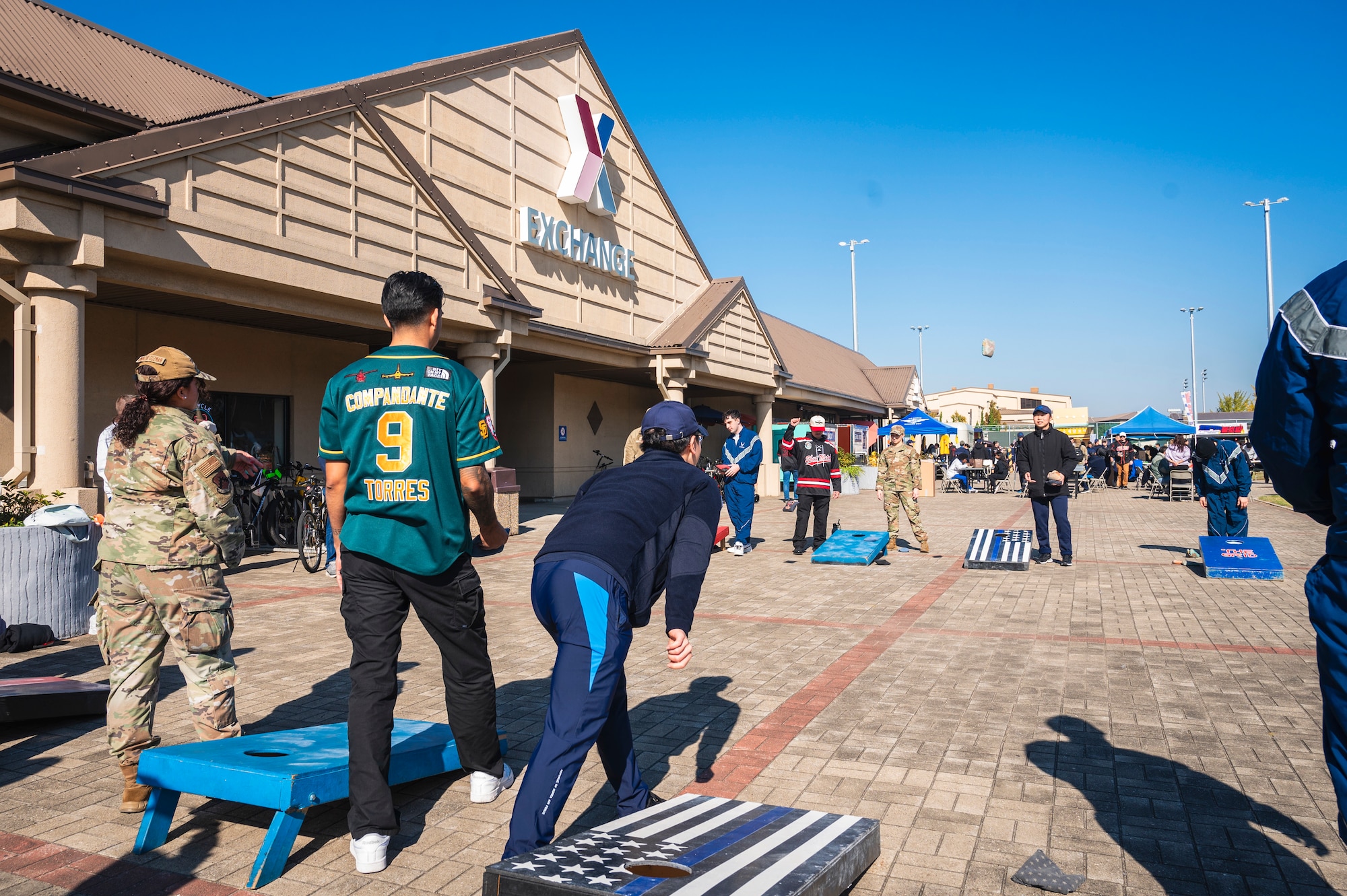 Members from the U.S. Air Force 8th Fighter Wing and the Republic of Korea Air Force 38th Fighter Group play cornhole during Friendship Day at Kunsan Air Base, R.O.K