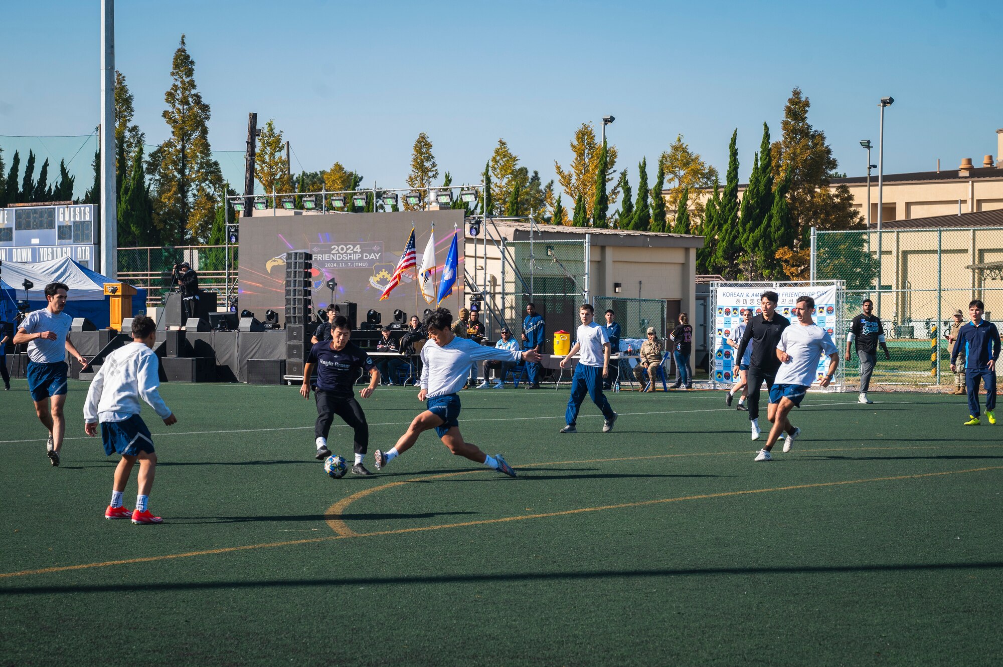 Members from the U.S. Air Force 8th Fighter Wing and the Republic of Korea Air Force 38th Fighter Group play soccer during Friendship Day at Kunsan Air Base, R.O.K.