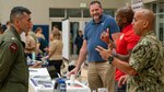 Navy Community College representatives discuss educational opportunities with Sailors at Career Development Symposium Southwest.