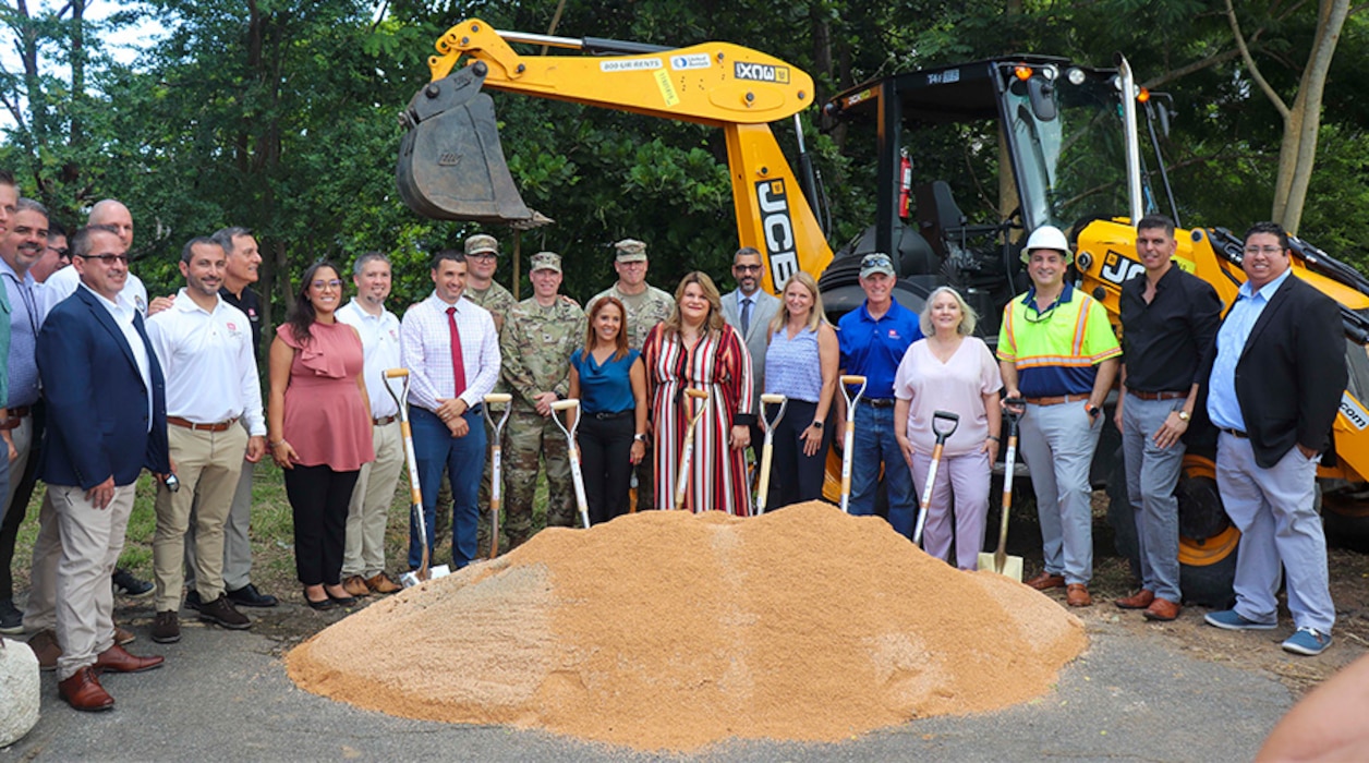People standing at groundbreaking.
