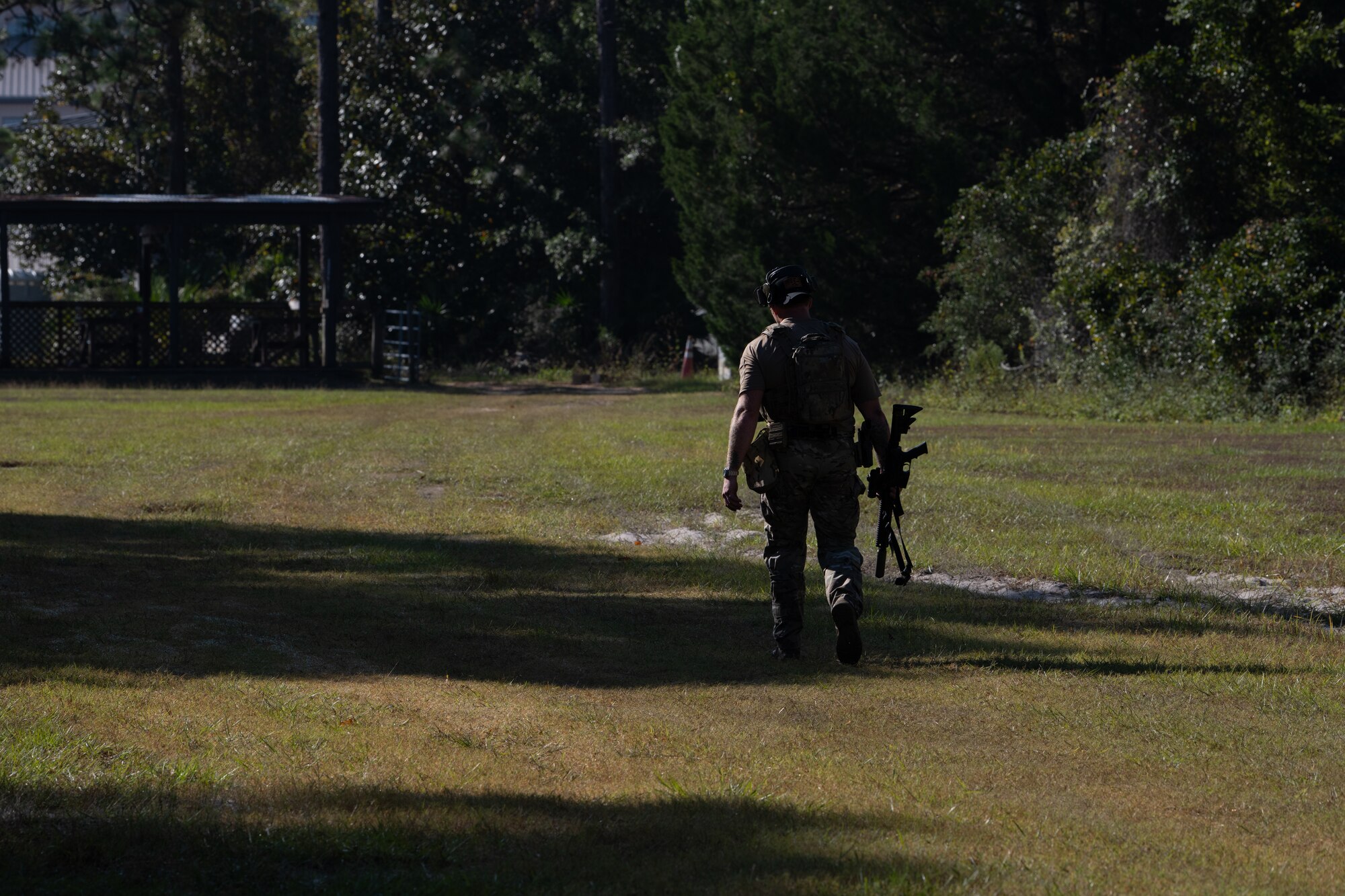 A U.S. Air Commando, a contestant for the Service Member of the Year, walks down a shooting range at Hurlburt Field, Florida, Oct. 29, 2024.