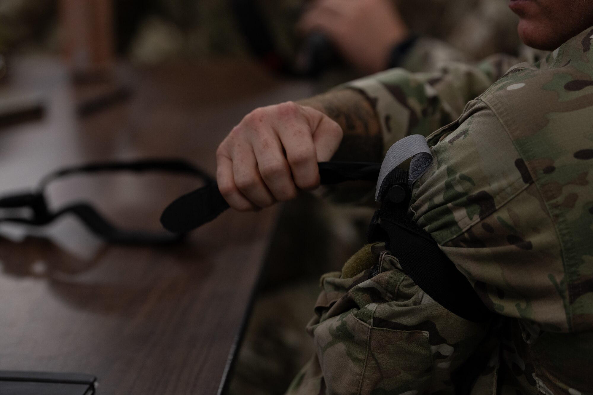 A U.S. Air Commando, a contestant for the Service Member of the Year, practices applying a tourniquet to himself at Hurlburt Field, Florida, Oct. 30, 2024.