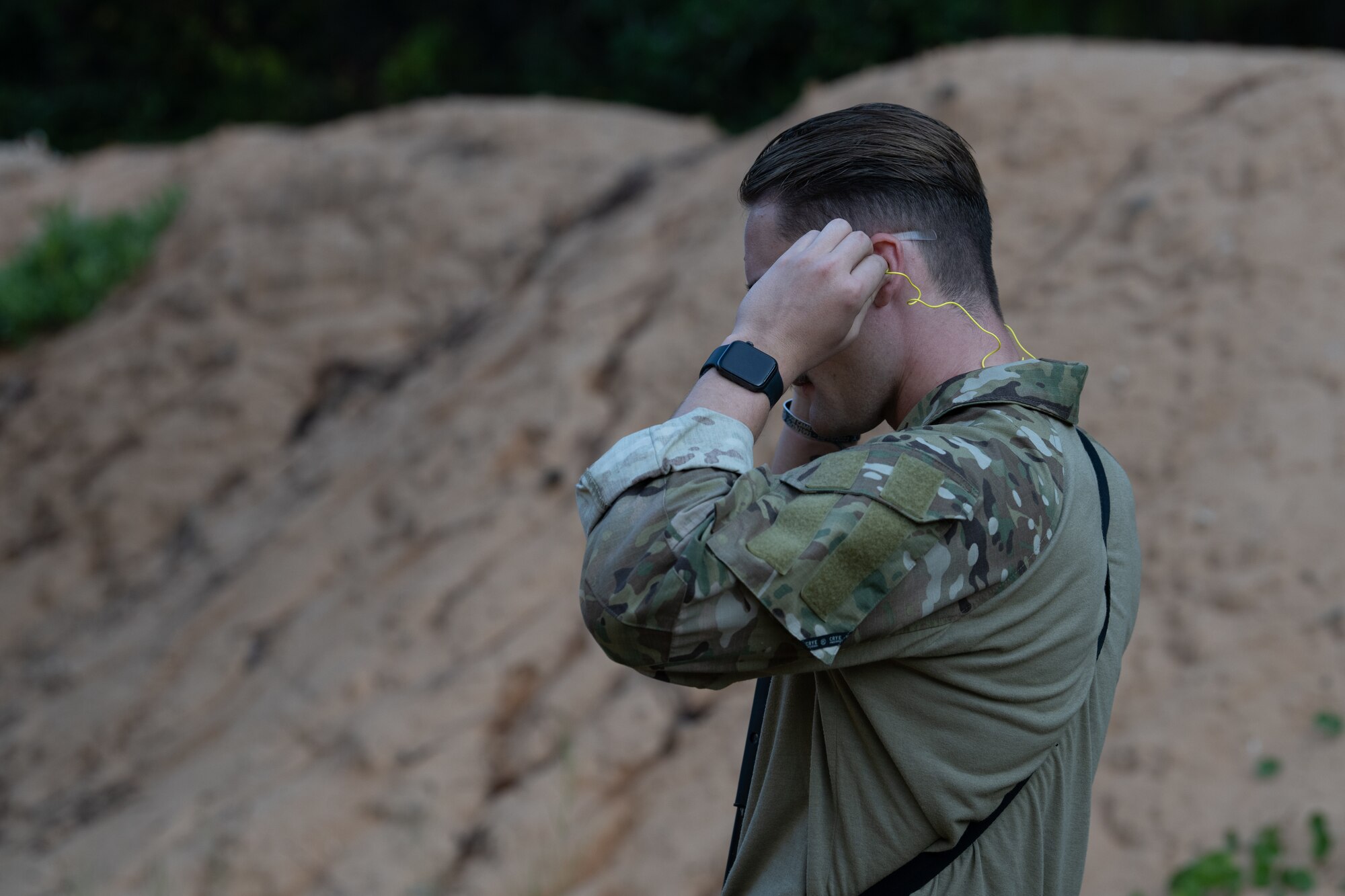 A U.S. Air Commando, a contestant for the Service Member of the Year puts in ear protection at Hurlburt Field, Florida, Oct. 29, 2024.